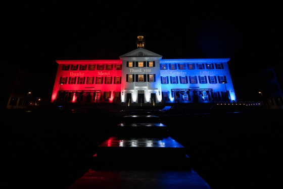 Dartmouth Hall lit up with red, white and blue lights
