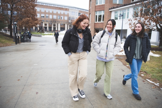 Madison Spivak, Vicqueline Escalona, and Liesbeth Verheijen walking to class
