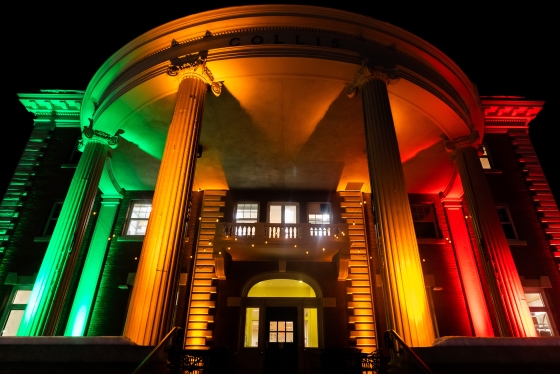 Collis Center lighted up in green, gold, and red, for Black Legacy Month.