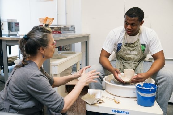 Jabari Johnson ’26 and instructor Sarah Heimann in the ceramics studio.