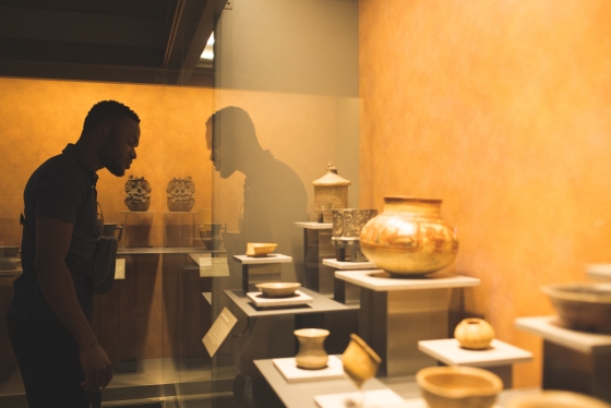 John Ejiogu '23 looks at artifacts