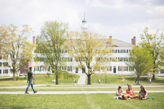 Students walking and sitting on the Green