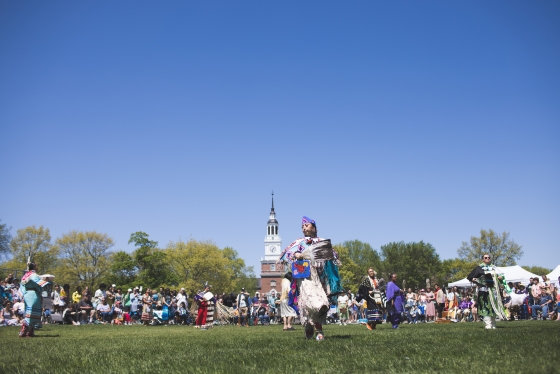 Dancers on the Green at Powwow surrounded by a crowd