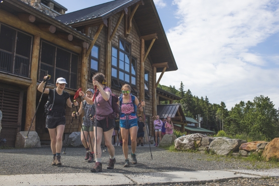 Caroline Mahoney , Naya Lunney, Dara Casey, and Anna St. Jean hike away from the Ravine lodge