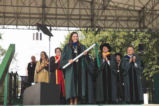 Sian Leah Beilock holds the Dartmouth Charter onstage at Inauguration