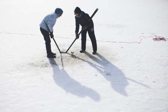 Two people on ice doing research