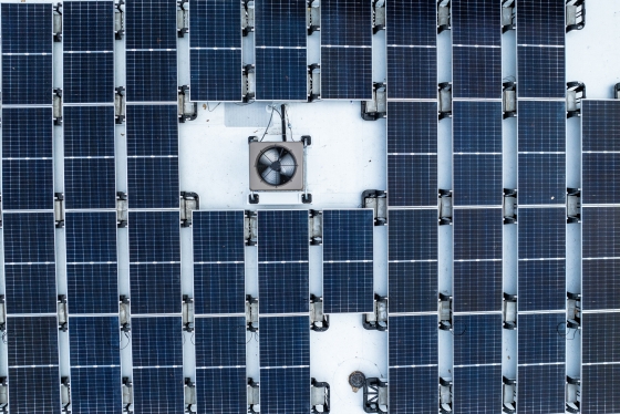 Aerial view of snowy solar panels