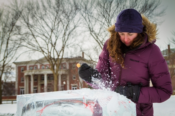 Rachel Van Gelder ’18 chips away at a block of ice near the start of the ice sculpture competition.