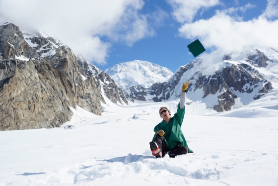 A student celebrates commencement from Alaska
