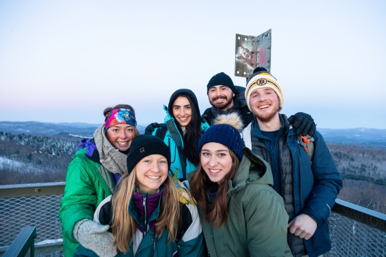 Students pose at the top of Gile Hill in Norwich, Vt.