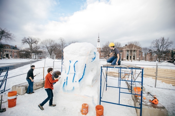 Students work on creating the snow sculpture for winter carnival