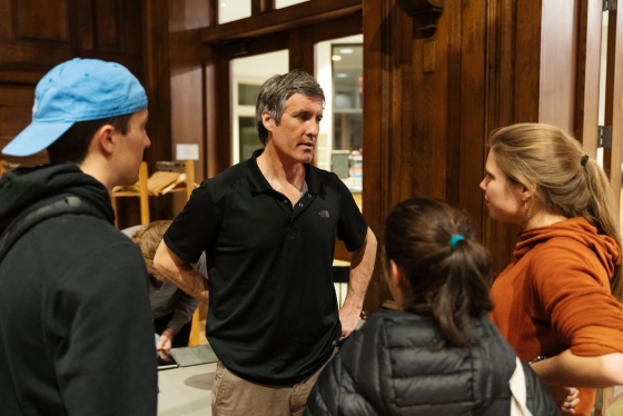 Mark Synnot speaks with students