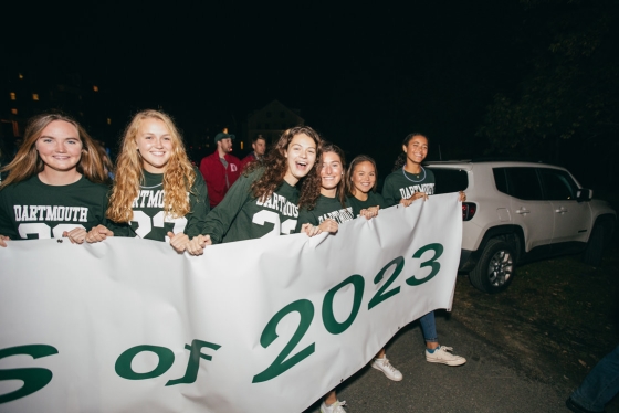 Students hold a sign that reads &quot;Class of 2023&quot; as they lead the parade