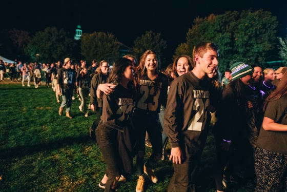 Students walk to the Green to see the bonfire.