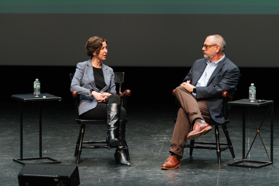 Executive Vice President Rick Mills talks with Alexis Abramson, the dean of Thayer School of Engineering, at the first town hall meeting of the academic year on Oct. 16 in Hopkins Center of the Arts' Spaulding Auditorium.