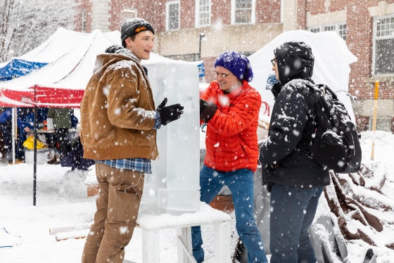 Students work on ice sculpture at Dartmouth