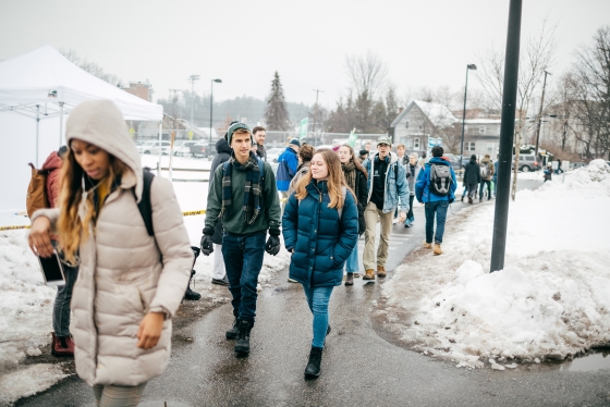 Students walk towards Hanover High School to vote in the New Hampshire Primary