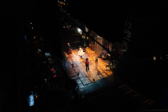 View from above of the stage and actors in the play 'The Sweet Science of Bruising'