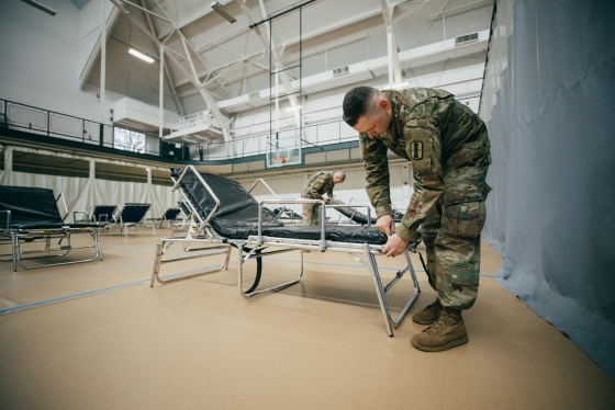 National Guard setting up cots in West Gym