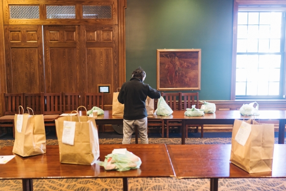 Students pick up their food, which is organized by last name. The orders are stapled to the bags to students can confirm they received what they ordered.