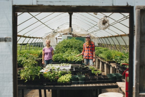 Farm Manager Laura Braasch and Molly McBride '14 inside the greenhouse at the Organic Farm.