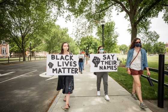 BLM protest organizer Associate Astronomy Professor Elizabeth Newton (right) leads the march around the green along with fellow astronomy grad students Elizabeth Newton McKinley Brumback (Left) and Christina Gilligan (center).