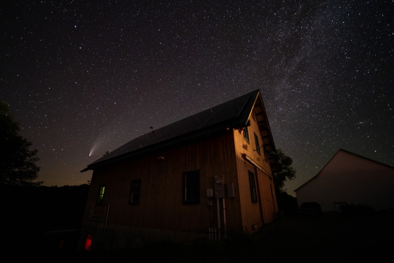 The Comet Neowise, on a clear moonless night, shines brilliantly in the western sky over the Organic Farm barn.