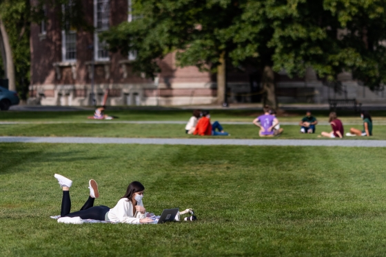 Student lounging on the Green