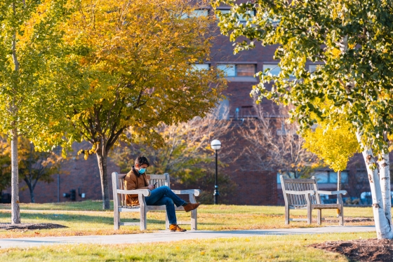 Student sitting on a bench