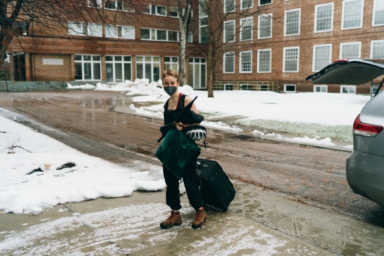 Hanna Michelson '23R carries her belongings toward her residence hall.