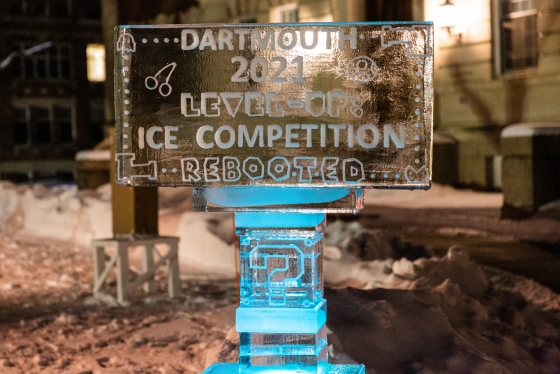 Sign carved in ice announcing ice carving competition