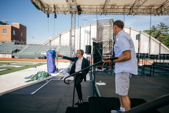 Provost Joseph Helble and Executive Director of Conferences and Events E.J. Kiefer discuss the commencement setup on Memorial Field.