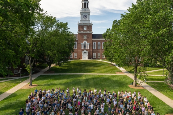 Some members of the Class of 2021 pose for the traditional class photo in a year that has been anything but traditional. The photo is usually taken with Dartmouth Hall as the backdrop. With Dartmouth Hall this year undergoing renovations, the iconic Baker