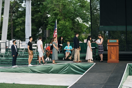 Students in line on the commencement stage to receive Class Day awards from Dean Lively.