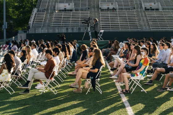 Class of 2021 seated, socially distanced, on Memorial Field during Class Day