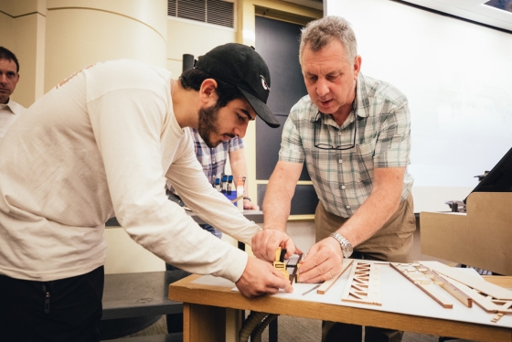 1.	Lee A. Schuette, manager of operations of the Thayer Machine Shop, leads a student during a Bridge Building class.