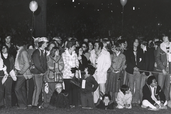 A crowd of students and other celebrants gather on the Green wait for the start of the festivities during Dartmouth Night in 1975.