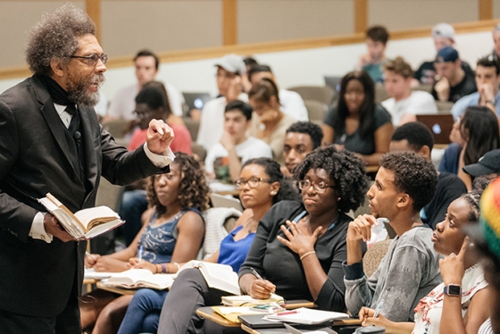 Cornel West delivering a lecture to students in a classroom