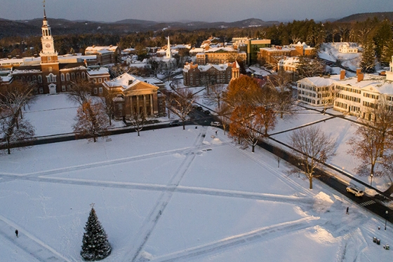 aerial photo of the Dartmouth Green covered in snow with a Christmas tree