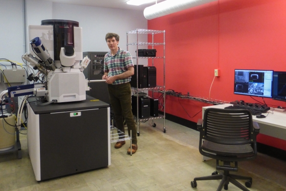 Maxime Guinel, director of the Electron Microscope Facility, shows off the state-of-the-art scanning electron microscope, which lets scientists see under the surface of the materials they study.