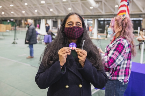Voter displaying her &quot;I voted&quot; sticker