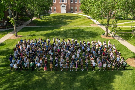 Some members of the Class of 2021 pose on Baker Lawn for the traditional end-of-the-year photo in a year that has been anything but traditional.