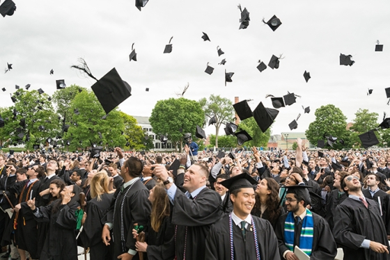 Students celebrate at the end of the commencement ceremony.