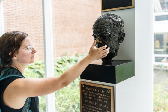 Elise Wien '17 takes part in an old tradition at Dartmouth: rubbing the nose of the Bentley bust when walking past it.