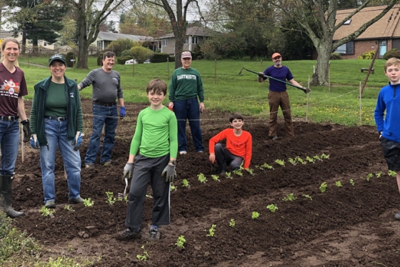 Dartmouth alumni and their families help grow organic vegetables as part of the Plant a Row for the Hungry project in Hartford,