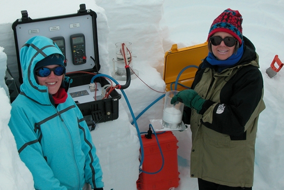 Alden Adolph Professor Mary Albert measuring snow