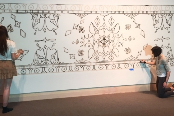 Hood Museum intern Eva Munday ’16, left, created this design for the paint-by-numbers mural activity.