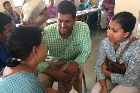 students interviewing a patient at an eye clinic in India