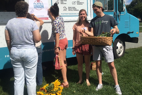 Members of Growing Change in front of the Plate of the Union food truck