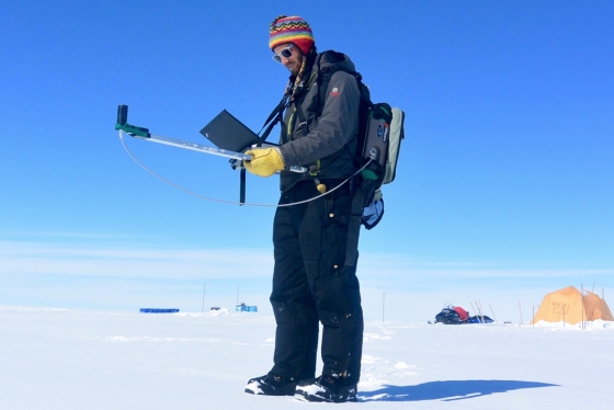Gabriel Lewis, Guarini '20, measures reflectivity on Greenland's ice sheet during a 2016 research expedition